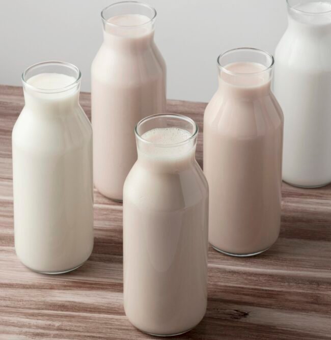 high-angle-different-types-milk-bottles